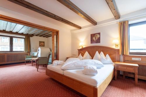 Ένα ή περισσότερα κρεβάτια σε δωμάτιο στο Heart Hotel Arlberg