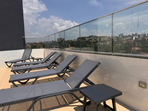 a row of chairs on the roof of a building at Cascadia Hotel Apartments by GF Greenland in Kigali