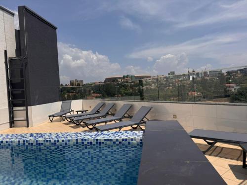 a swimming pool on the roof of a building at Cascadia Hotel Apartments by GF Greenland in Kigali