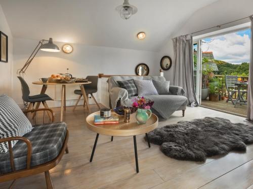 a living room with a couch and a table at 1 Bed in Coniston LCC37 in High Nibthwaite