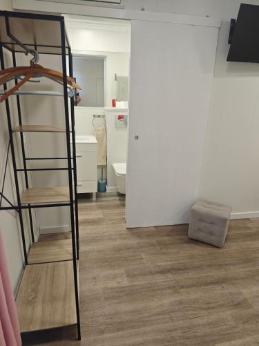 a room with a bunk bed and a ladder at Residencial Melba in Funchal