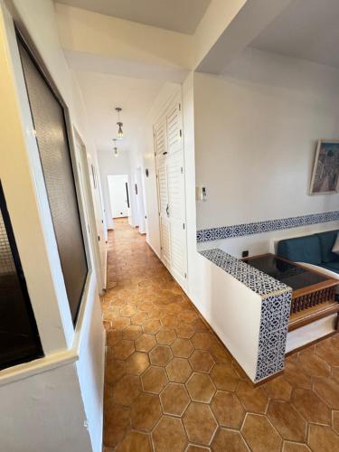 a hallway of a house with a tile floor at C2 Résidence CHATT in Tetouan