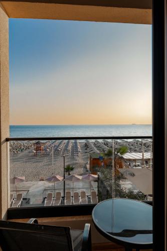 a view of the beach from the balcony of a resort at Aks Hotel in Durrës