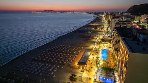 an aerial view of a beach at night at Aks Hotel in Durrës