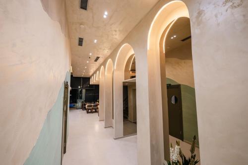 a hallway of a house with arched ceilings at Aks Hotel in Durrës