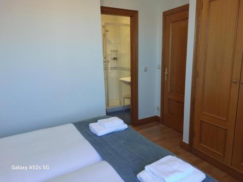 A bed or beds in a room at Centenario