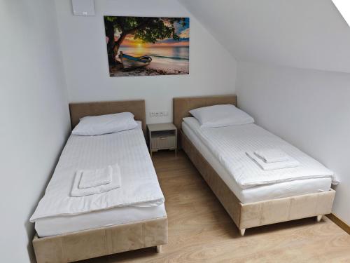 Ένα ή περισσότερα κρεβάτια σε δωμάτιο στο Apartamenty Zielona Lipka