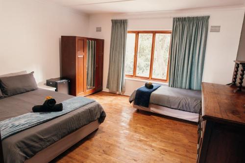 Postel nebo postele na pokoji v ubytování Wilderness Backpackers