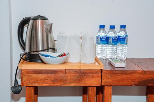 a table with bottles of water and paper towels at Coastal Heaven Villa in Trincomalee