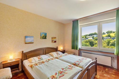 Ένα ή περισσότερα κρεβάτια σε δωμάτιο στο Haus am Osterkopf
