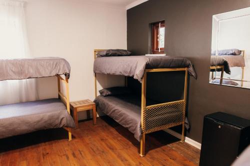 Postel nebo postele na pokoji v ubytování Wilderness Backpackers