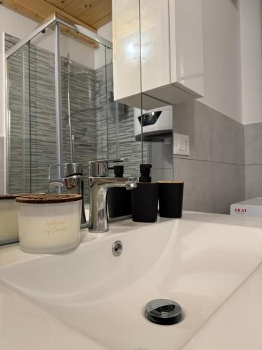 a kitchen counter top with a sink and a kitchen at Francesco's house-airport in Bologna
