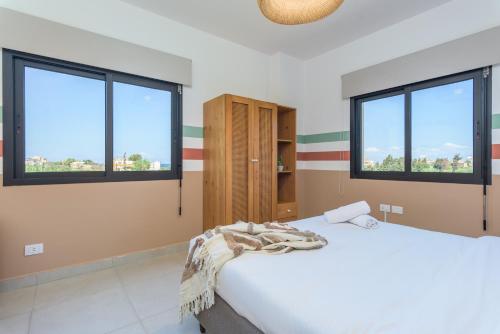 Postel nebo postele na pokoji v ubytování Glow - Stylish Apartments & Rooftops in Batroun