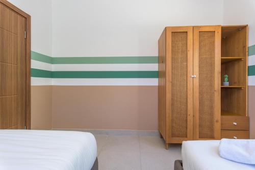 Postel nebo postele na pokoji v ubytování Glow - Stylish Apartments & Rooftops in Batroun