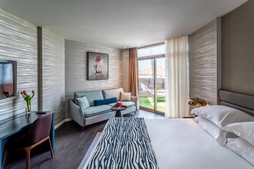 Postel nebo postele na pokoji v ubytování Daniel Herzliya Hotel