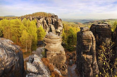 a man standing on top of a rock formation at Penzion Festung in Petrovice