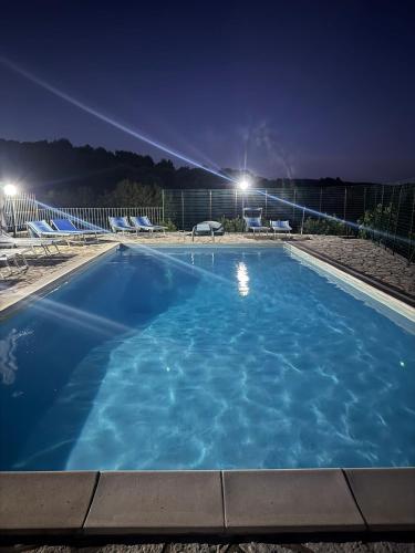 a large swimming pool at night with lights at Seamoon Residence in Marina di Camerota