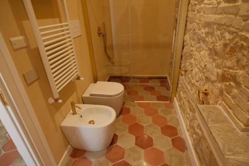 a bathroom with a toilet and a shower at Leano Agriresort in Piazza Armerina