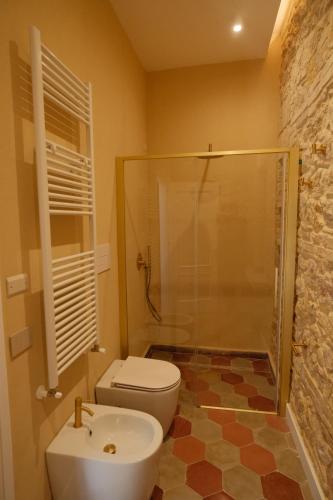 a bathroom with a shower and a toilet and a sink at Leano Agriresort in Piazza Armerina