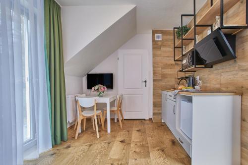 Kuchyň nebo kuchyňský kout v ubytování Apartamenty Śniadanie do Łóżka