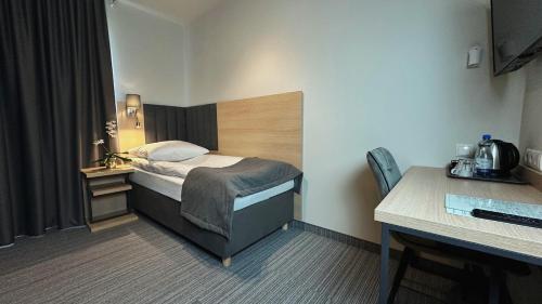 Кровать или кровати в номере Hotel Turkus