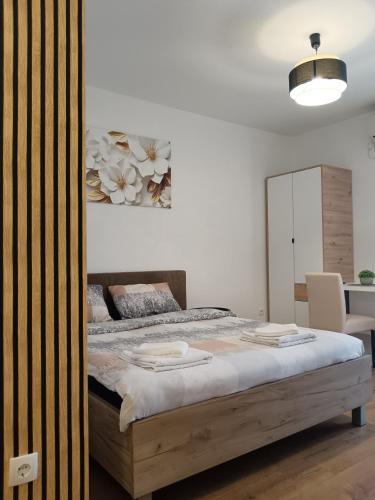 Postel nebo postele na pokoji v ubytování Alacaster B apartman
