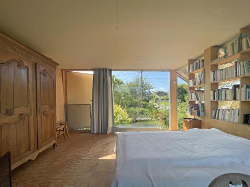 Ένα ή περισσότερα κρεβάτια σε δωμάτιο στο Maison Quatre Saisons