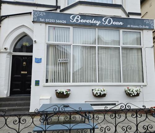 a building with a bench in front of it at Beverley Dean in Blackpool