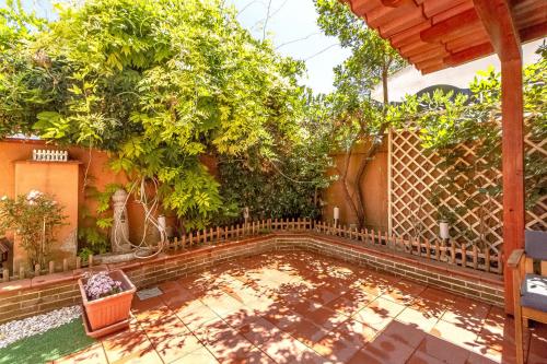 a swimming pool in the backyard of a house with trees at Charlotte Apartment - For family and groups in Porto Torres