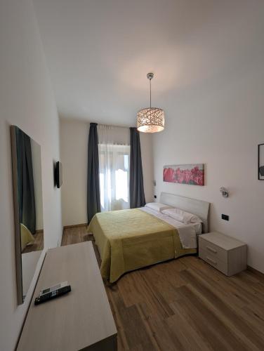 Ένα ή περισσότερα κρεβάτια σε δωμάτιο στο Maison Maurizio Marconi