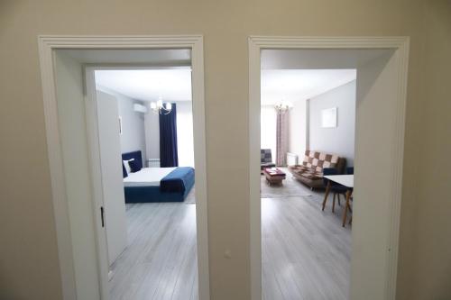 a room with a bedroom and a living room at Passage Hotel in Baku