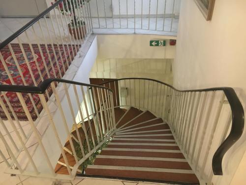 a spiral staircase in a building at Pension Ani-Falstaff in Vienna