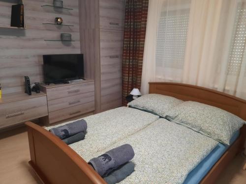Postel nebo postele na pokoji v ubytování Bodza Apartman