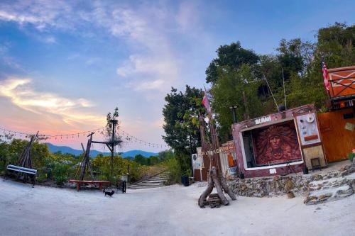 a building with a large screen on the side of it at Baan Bonkao Resort Sattahip in Ban Khlot