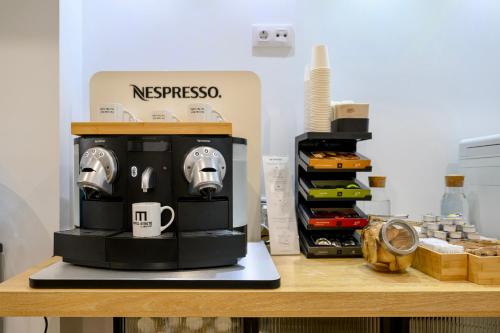 a coffee maker sitting on top of a table at Hotel Emeté & Coworking by Airnest in Las Palmas de Gran Canaria