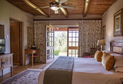 Ένα ή περισσότερα κρεβάτια σε δωμάτιο στο De Denne Country Guest House