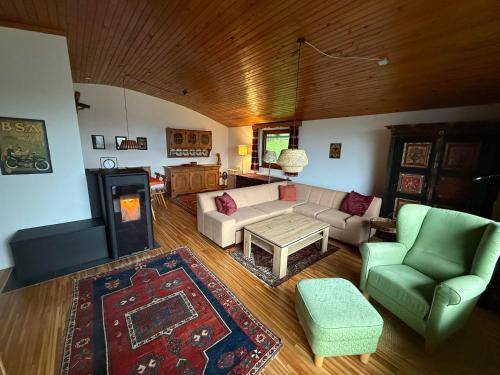 an overhead view of a living room with a couch and chairs at Ferienhaus Kötschach 356 in Kötschach