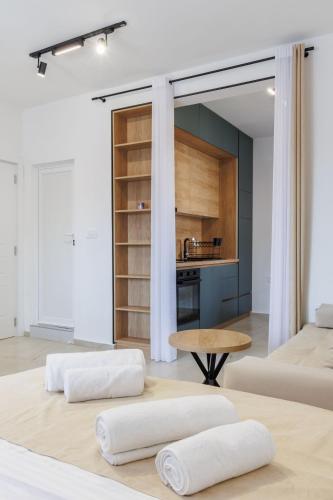 a living room with two beds and a table at Apartments Donna in Bar