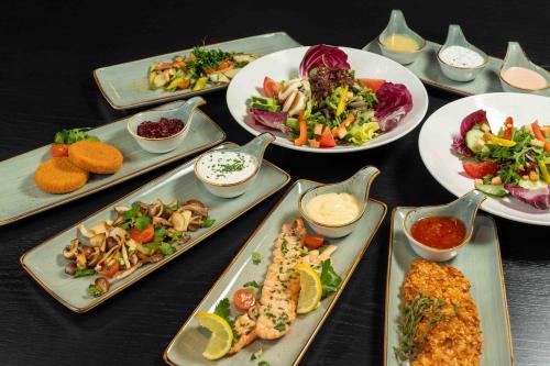 a group of plates of food on a table at Ramada by Wyndham Essen in Essen