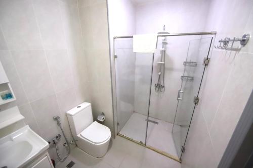 a bathroom with a shower and a toilet at Passage Hotel in Baku
