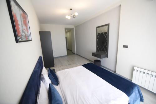 a bedroom with a large bed in a room at Passage Hotel in Baku