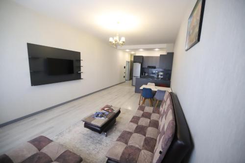 a living room with a couch and a table at Passage Hotel in Baku
