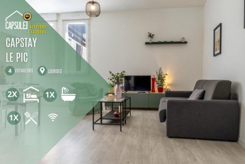 a living room with a couch and a table at Capstay Lourdes - Residence Serenity in Lourdes
