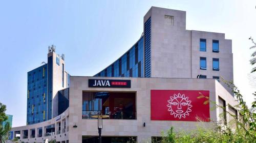 a building with a sign on the side of it at Cascadia Hotel Apartments by GF Greenland in Kigali