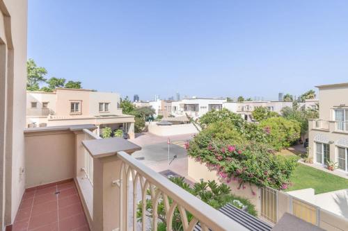 an apartment balcony with a view of a neighborhood at Free housekeeping visits during your stay - StayShort - Vibrant Villa in Springs 11 Sleeps 6 with Balcony in Dubai