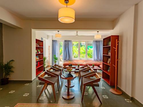 a living room with chairs and a couch at The Hosteller Goa, Old Goa in Old Goa