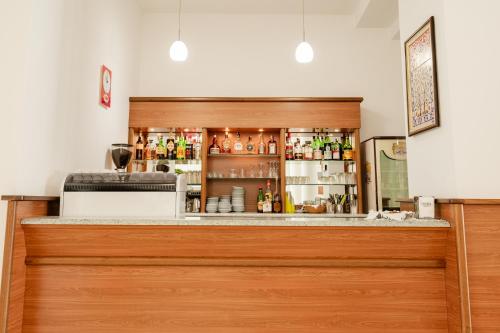 a bar at a restaurant with a counter at Hotel Sfinalicchio in Vieste