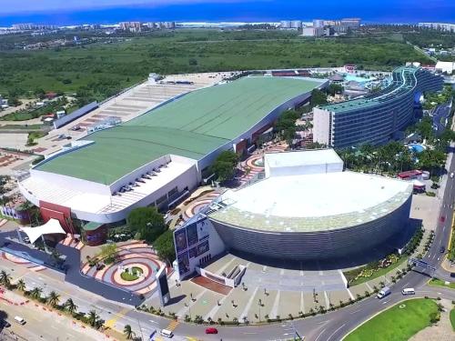 an aerial view of a building with a soccer field at Departamento Mayan Lakes T9 - Albercas, club de playa, tenis, pádel y más in Acapulco