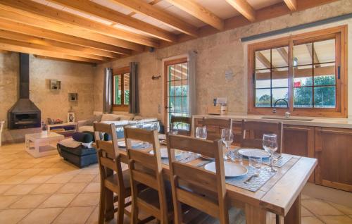 a kitchen and dining room with a table and chairs at Sa Sargantana in Llucmajor