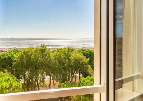 a view of the beach from a window at Hotel & Residence Venezia 2000 in Venice-Lido
